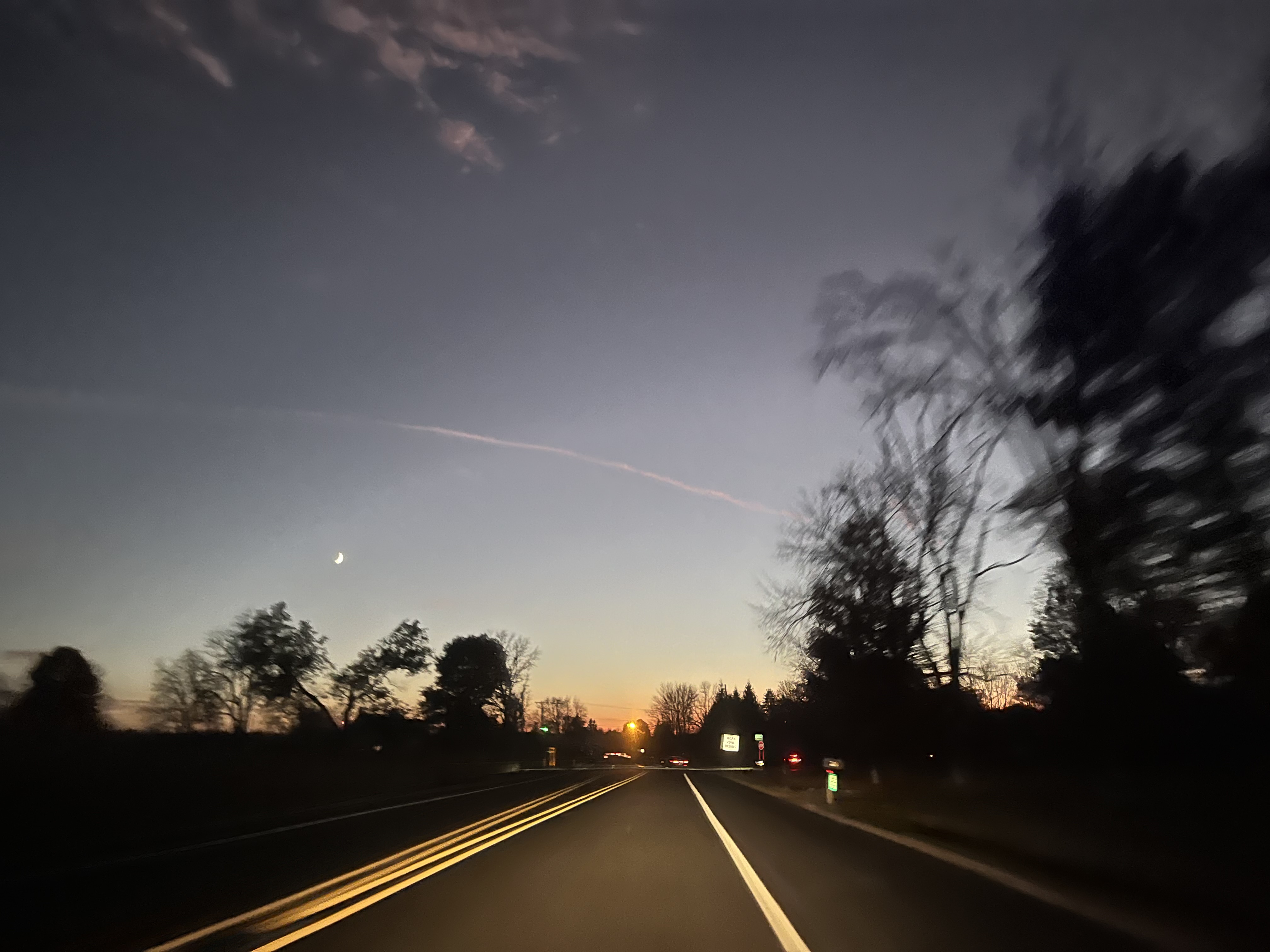 Picture of a suburban road during a sunset